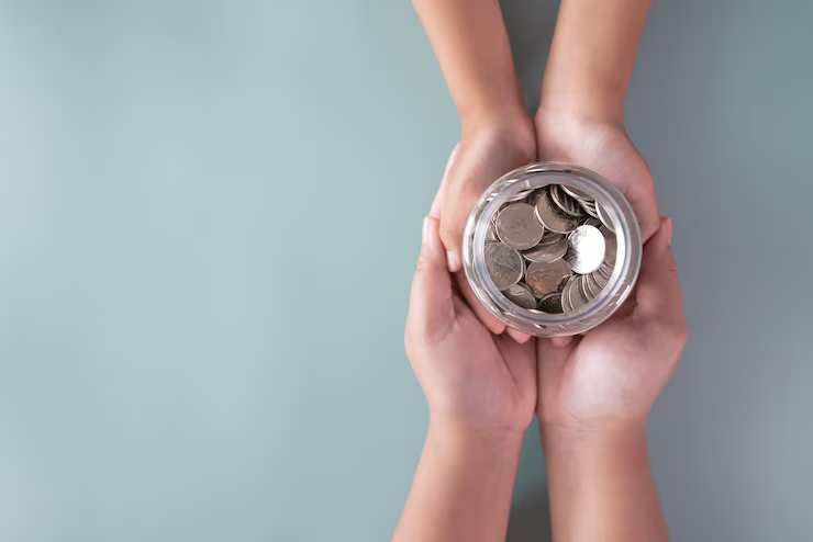 hands-holding-coins-jar-savings hands-holding-coins-jar-savings